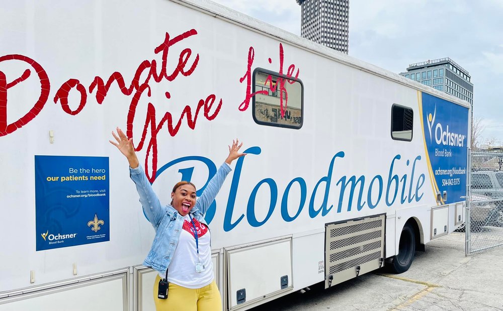 Donate give Live bloodmobile teacher posing